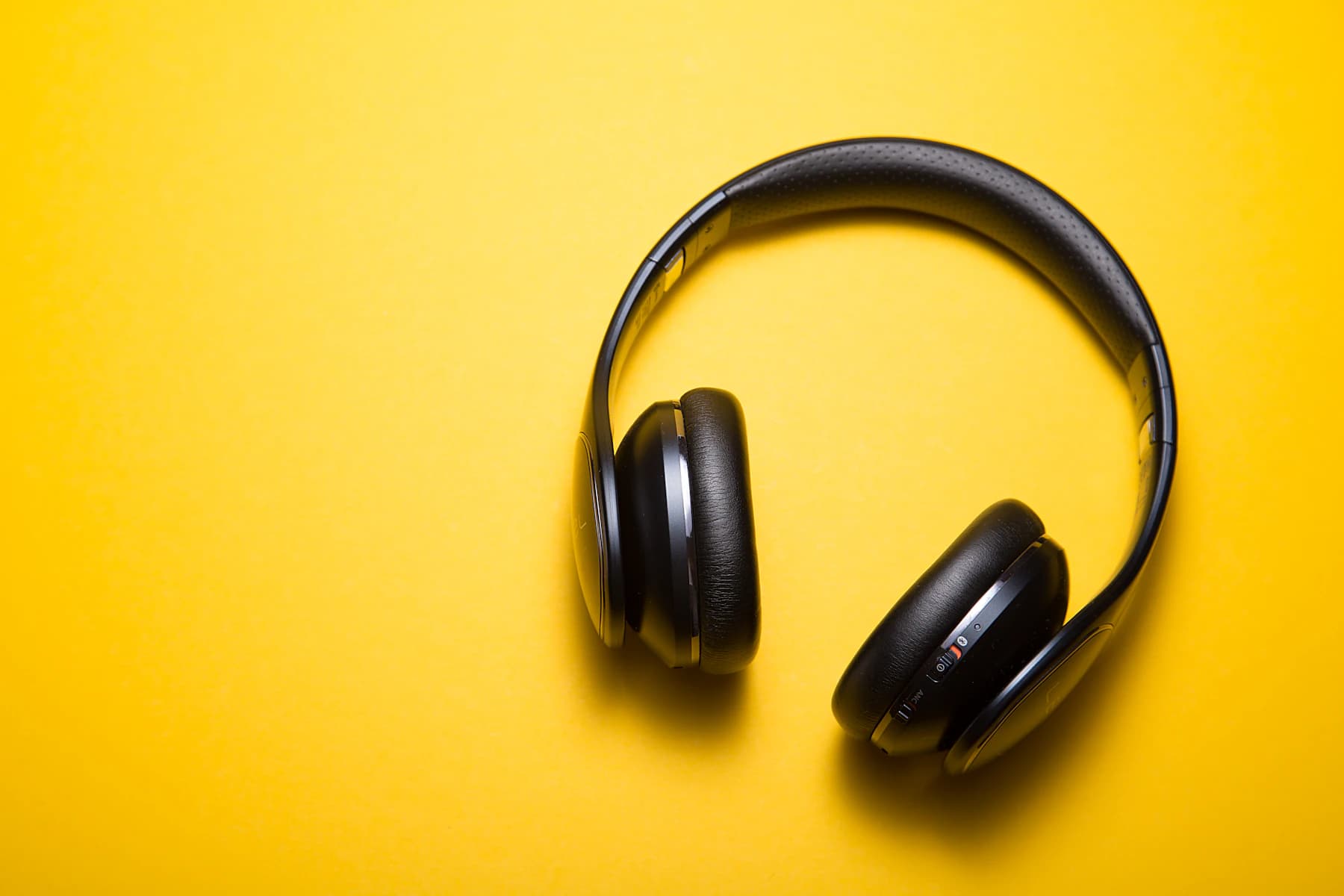 Headphones resting on a pale surface